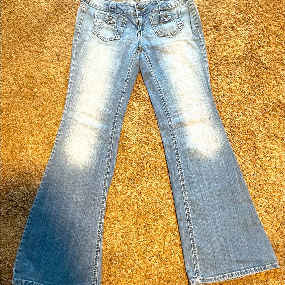 Gently used bootcut or flared leg jeans. Minimal signs of wear. Faded style.